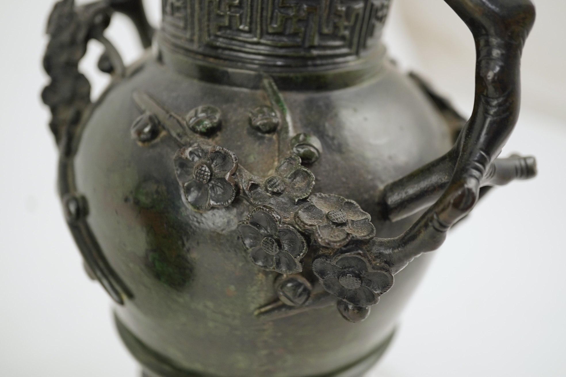 A pair of Chinese bronze gu-shaped vases, Qing dynasty